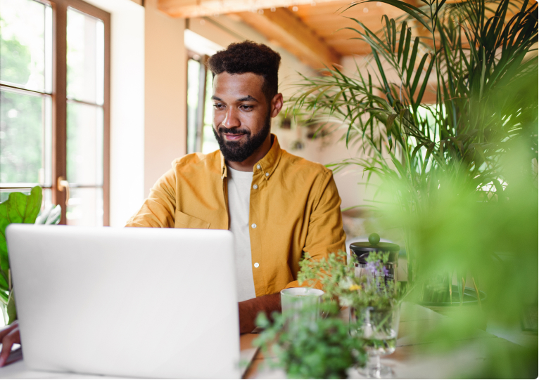 Aya Locums image of a man on a laptop